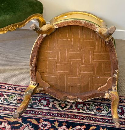 PAIR OF WHEELCHAIRS in molded and gilded...