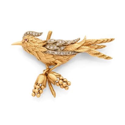 BROCHE
présentant un oiseau aux plumes texturées...
