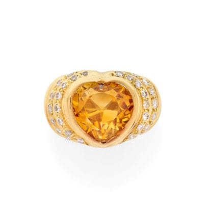 BAGUE
retenant une citrine coeur serti clos...