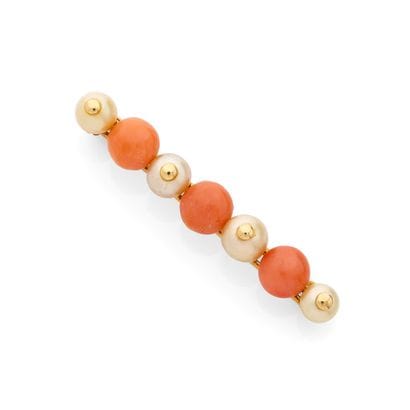 BARETTE BROOCH
featuring alternating cream-colored...