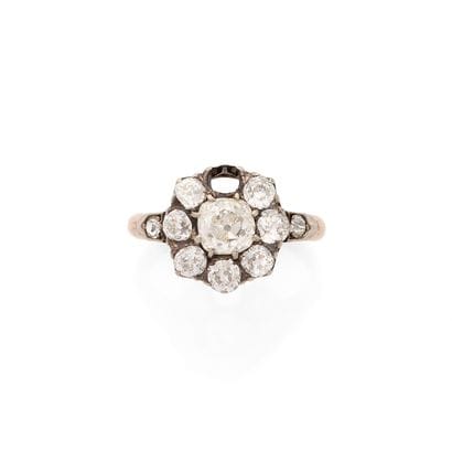 RING
Featuring an old-cut diamond set within...
