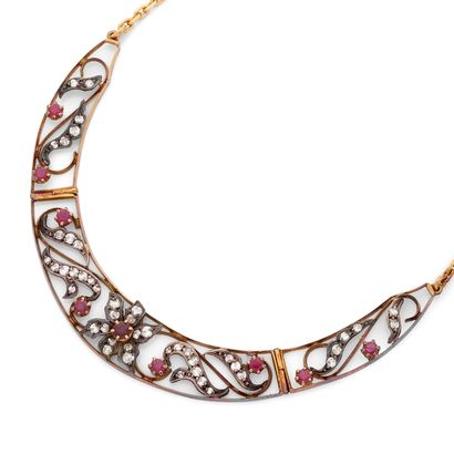 NECKLACE
A garland featuring three articulated...