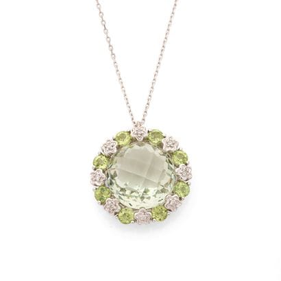PENDENTIF 
retenant un quartz vert rond facetté...