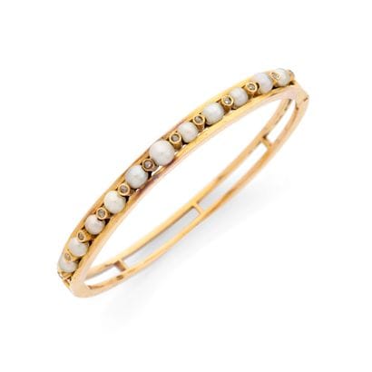 BANGLE BRACELET 
Oval-shaped, featuring a...