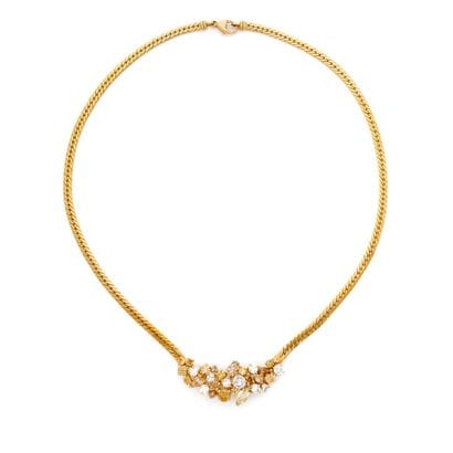 COLLIER
présentant un décor asymétrique pavé...