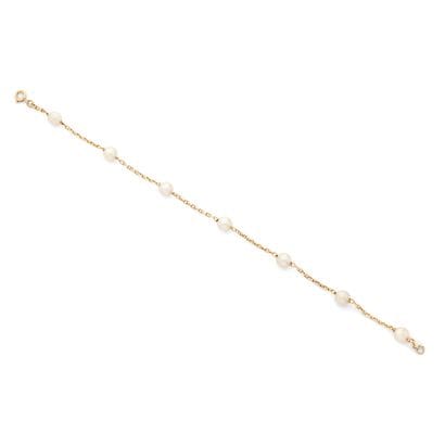 BRACELET
présentantt 7 perles crèmes (non...