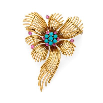 BROCHE
présentant un motif floral au décor...
