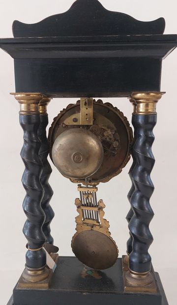 PENDULE in blackened wood, twisted columns,...