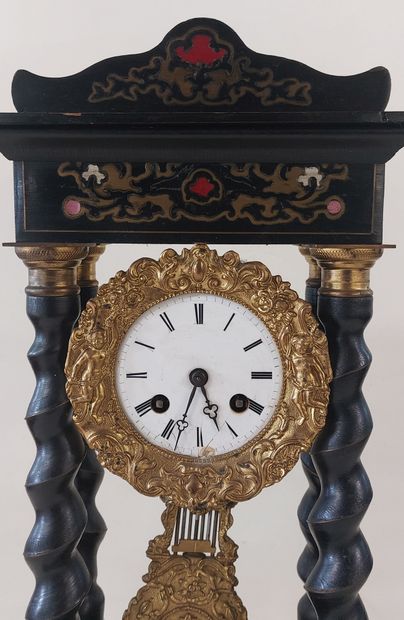 PENDULE in blackened wood, twisted columns,...