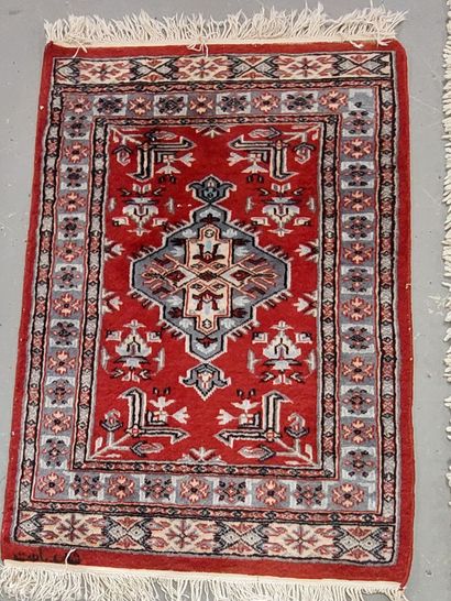 LOT of four handmade wool rugs

- boukhara...