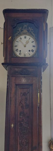 FLOOR CLOCK in moulded and carved oak, with...