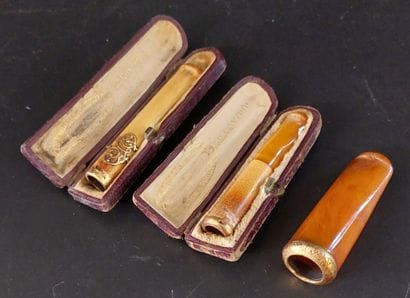 THREE CIGARETTE SMOKES in amber, gold ri...