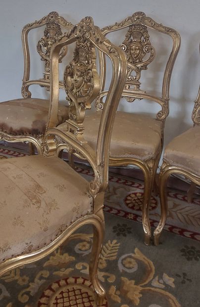 SUITE OF FOUR Gilded wood chairs with openwork...