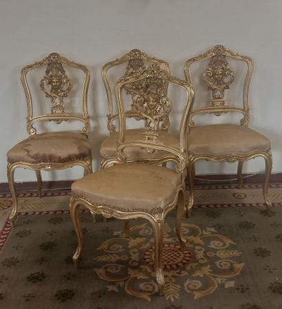 SUITE OF FOUR Gilded wood chairs with openwork...