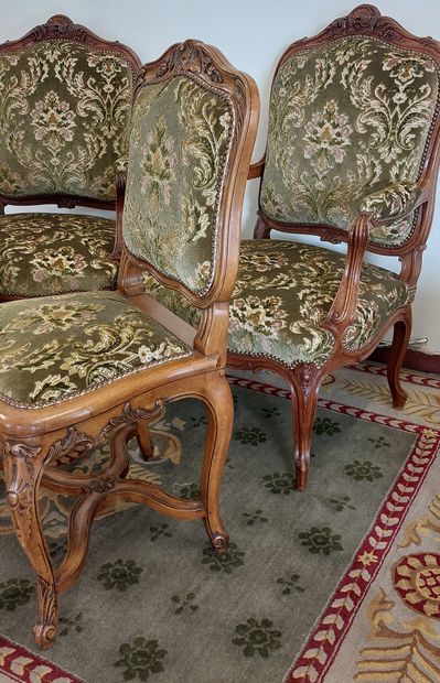 PAIR OF ARMCHAIRS in molded and carved natural...