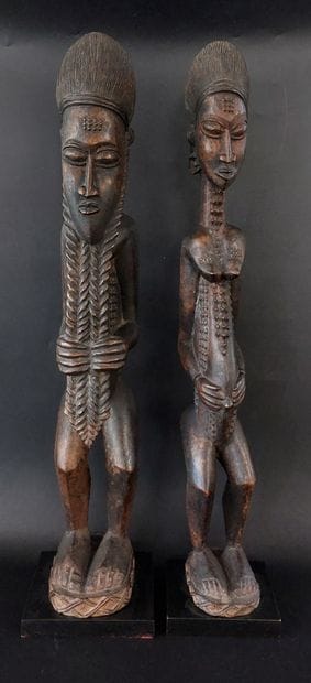 BAOULE 

Two statuettes in carved wood 

20th...