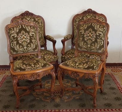 PAIR OF ARMCHAIRS in molded and carved natural...