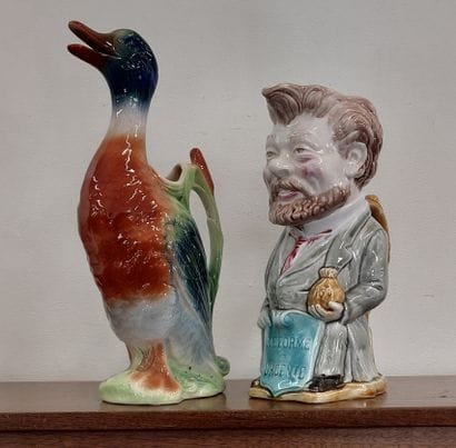 TWO PICTLES in barbotine, one in the shape...