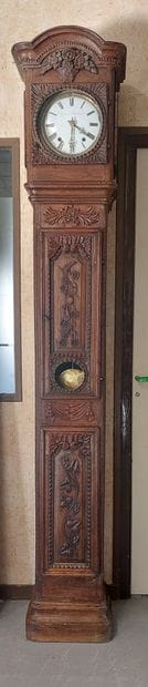 FLOOR CLOCK in moulded and carved oak decorated...