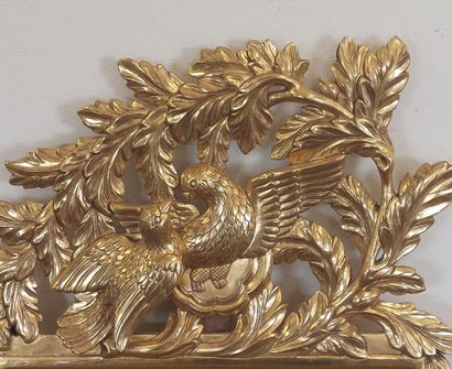 Wood and gilded stucco pediment mirror decorated...