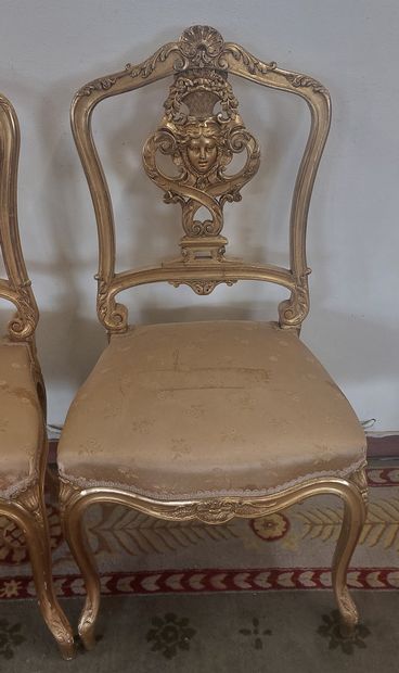 SUITE OF FOUR Gilded wood chairs with openwork...