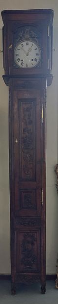 FLOOR CLOCK in moulded and carved oak, with...