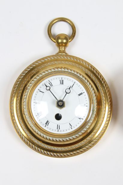 SMALL WALL CLOCK
in brass. White enamel dial...