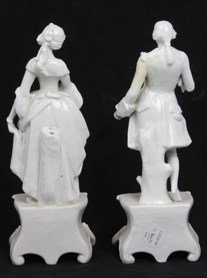 PAIR OF WHITE PORCELAIN FIGURINES
depicting...