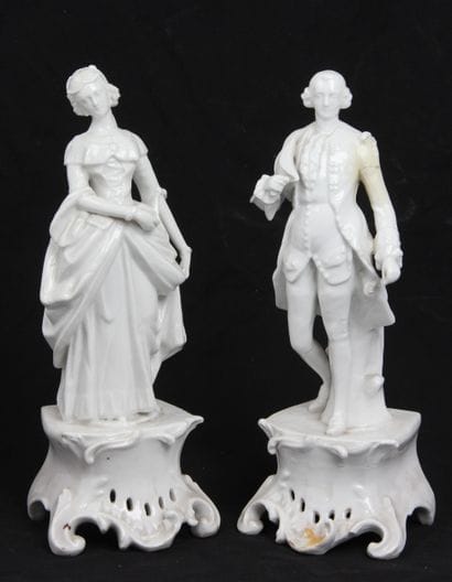 PAIR OF WHITE PORCELAIN FIGURINES
depicting...