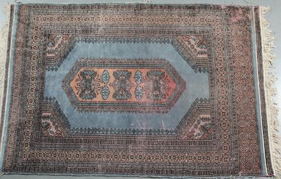 TUCKMAN RUG, featuring a dusty pink central...
