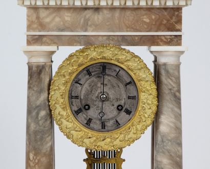 ALABASTER AND BROWN MARBLE CLOCK AND CANDLESTICK....