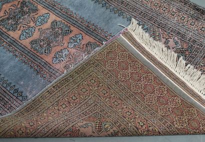 TUCKMAN RUG, featuring a dusty pink central...