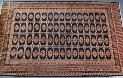 TUCKMAN RUG, featuring a dusty pink central...