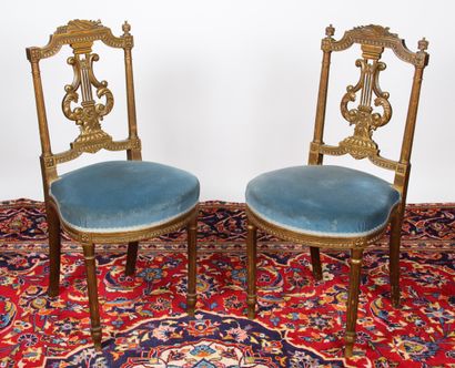 Pair of Louis XVI style chairs in gilded,...