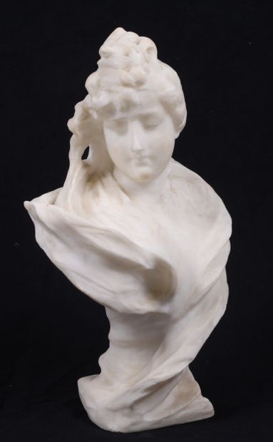 BUST OF A YOUNG WOMAN, facing right, in alabaster.
Circa...