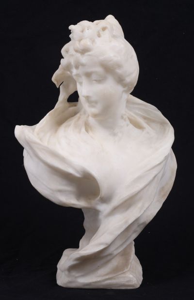 BUST OF A YOUNG WOMAN, facing right, in alabaster.
Circa...