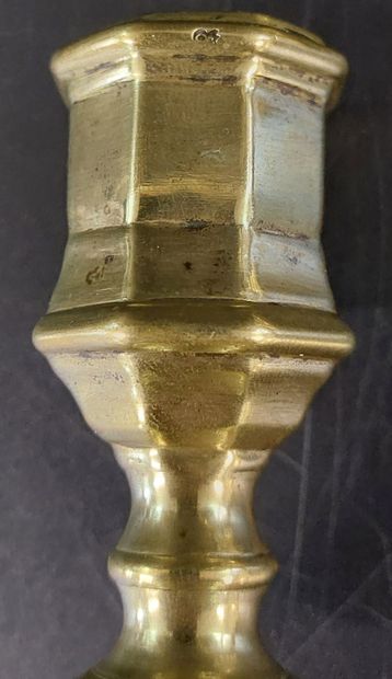 TWO BRONZE CANDLESTICKS, one of which is...
