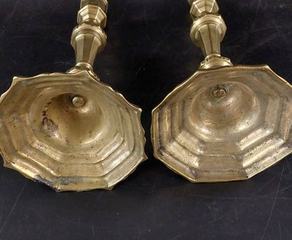 TWO BRONZE CANDLESTICKS, one of which is...