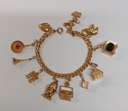 BRACELET à breloques en or 18K et pierres...