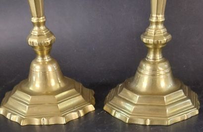 TWO BRONZE CANDLESTICKS, one of which is...