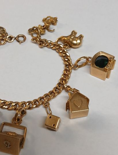 BRACELET à breloques en or 18K et pierres...