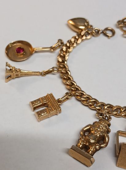BRACELET à breloques en or 18K et pierres...