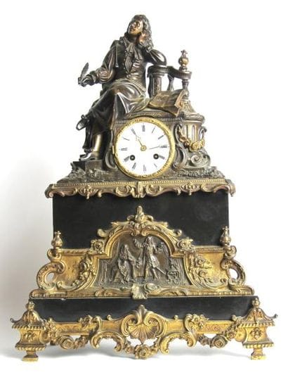 PENDULE en onyx et bronze à patine dorée...