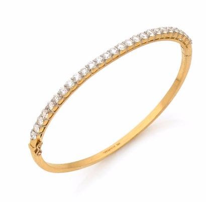 TIFFANY AND CO JONC en or jaune serti d’une...