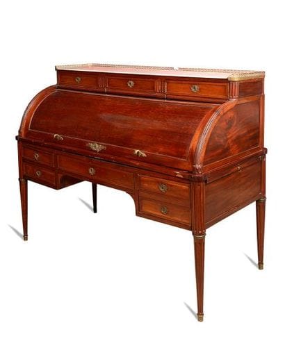BUREAU CYLINDRE en placage d'acajou à deux...