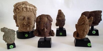 Collection de 11 TETES SCULPTEES en pierre,...