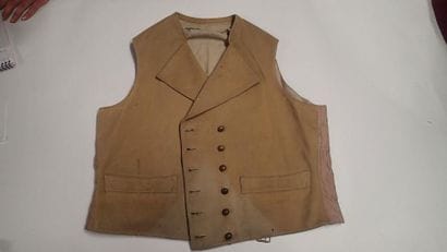 Gilet en drap chamois, à revers, deux poches...