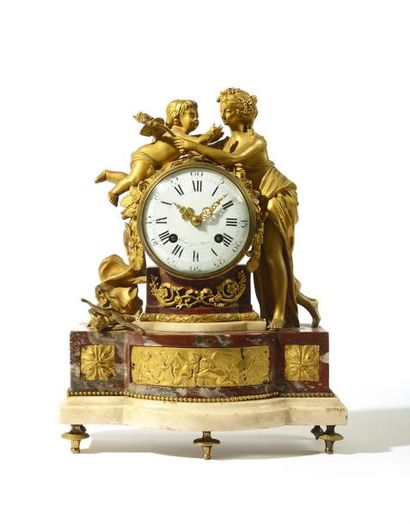 PENDULE en bronze doré et marbre rouge, 