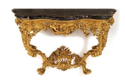 CONSOLE de forme mouvementée en bois redoré,...
