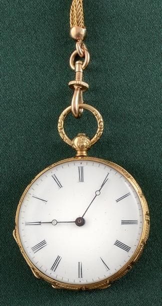 MONTRE DE POCHE

Boîtier rond en or jaune...